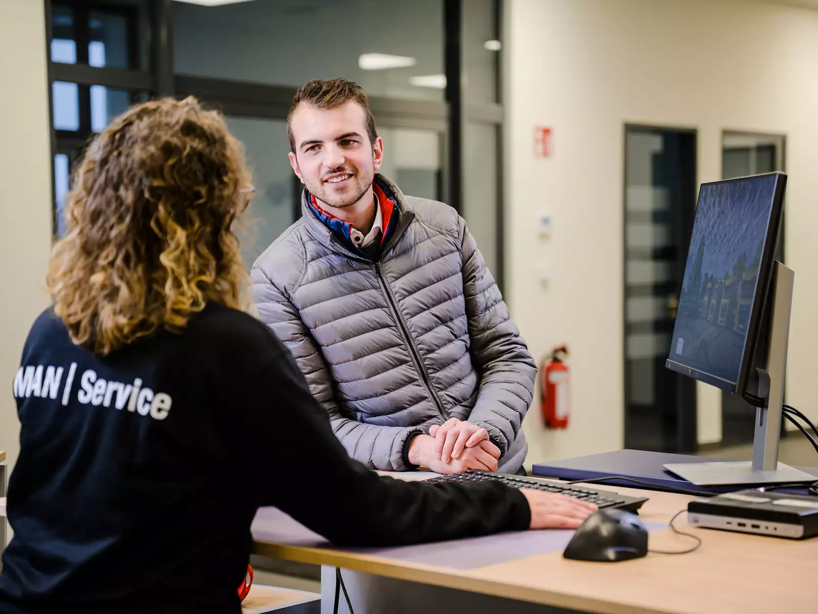 MAN Service reception — a customer being looked after at the service desk